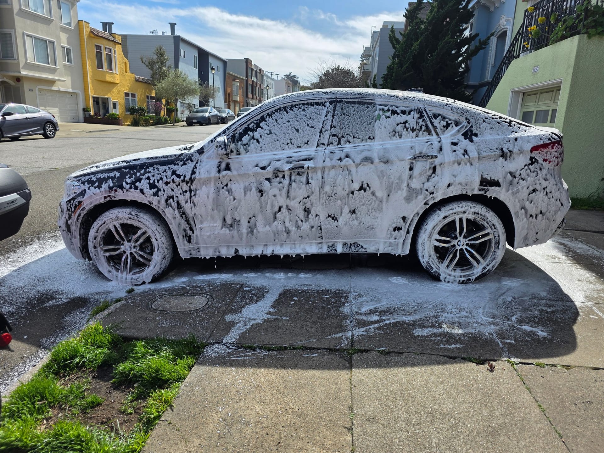 Luxury SUV foam wash on location in San Francisco.