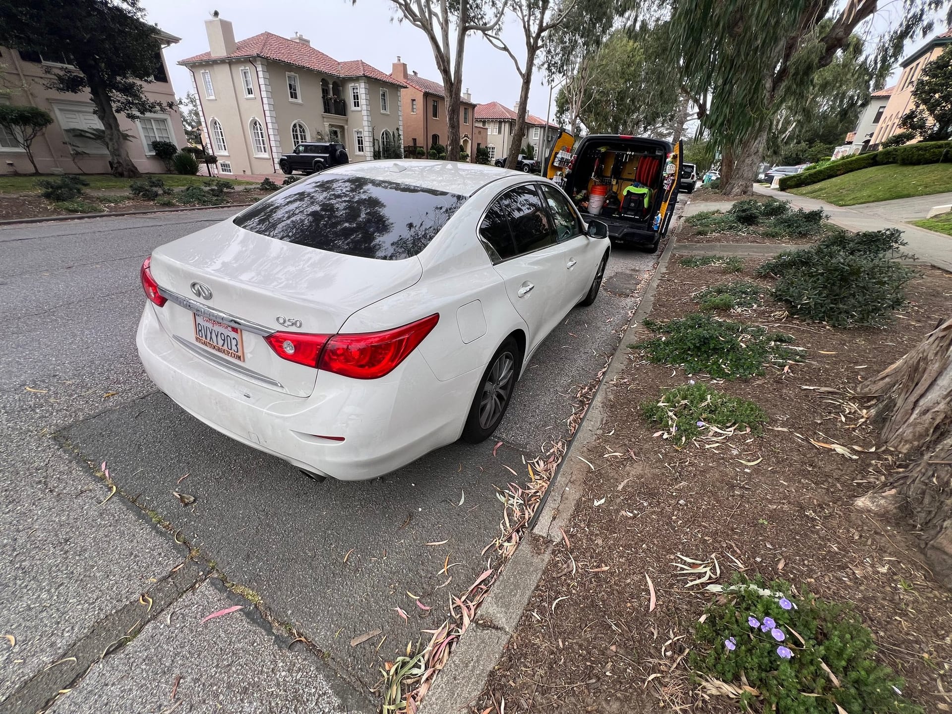 Innovo mobile detailing service at a residential driveway.