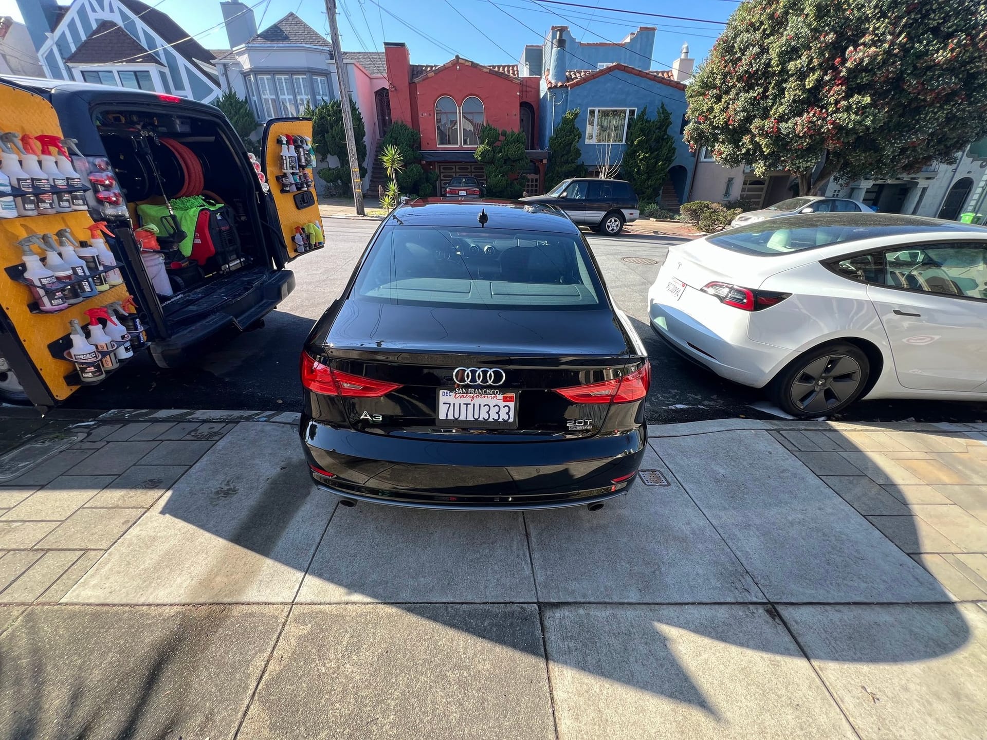 Mobile detailing on a luxury sedan in San Francisco.