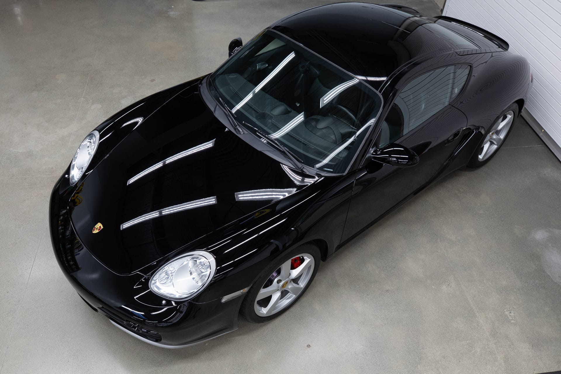 Black Porsche Cayman finished in STEK DYNOblack-gloss Fashion Film.