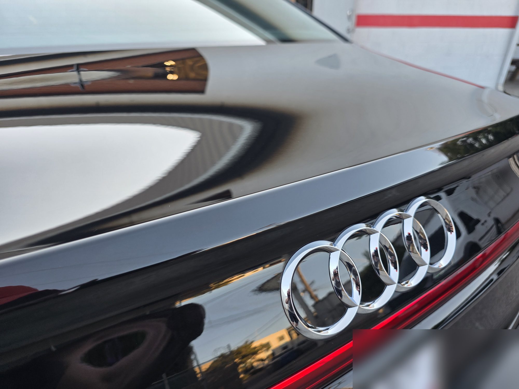Trunk lid and rear Audi rings on a black S8 after P&S STOUT ceramic coating.