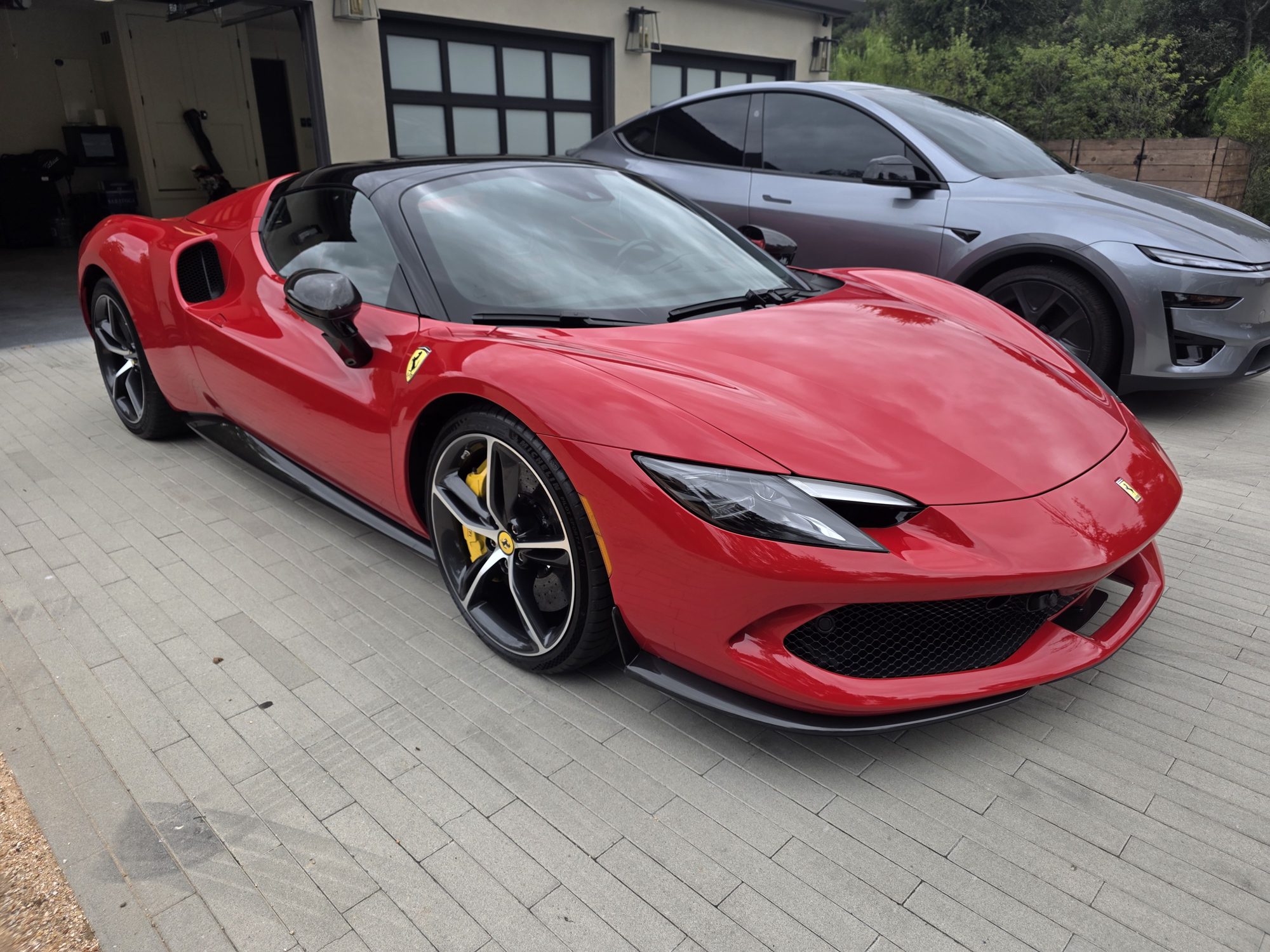 Front three-quarter view of a red Ferrari 296 GTS after ceramic coating, the hood reflecting an overcast sky.