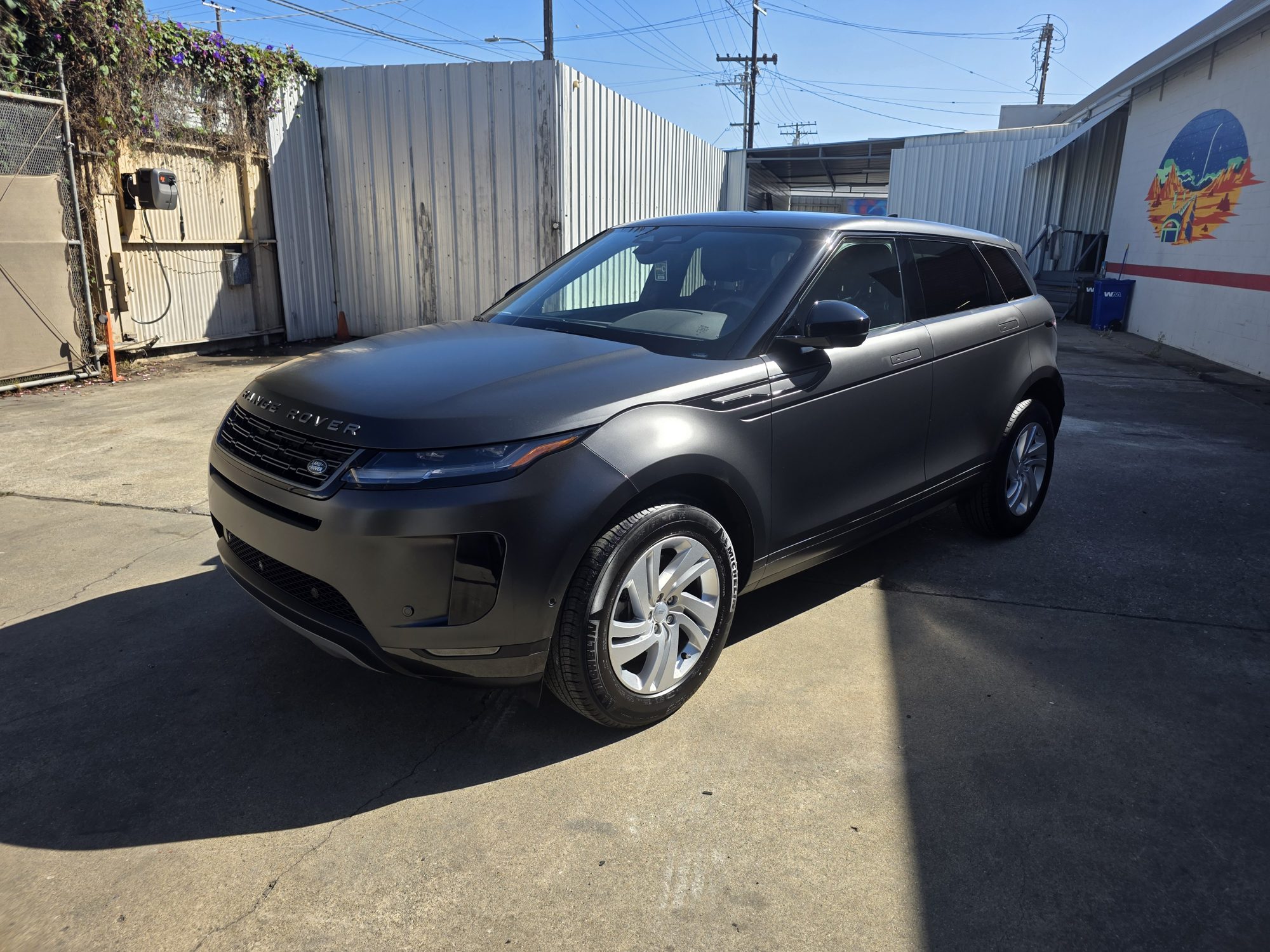 Front three-quarter view of a satin grey Range Rover Evoque after a full-body matte PPF install in Oakland.